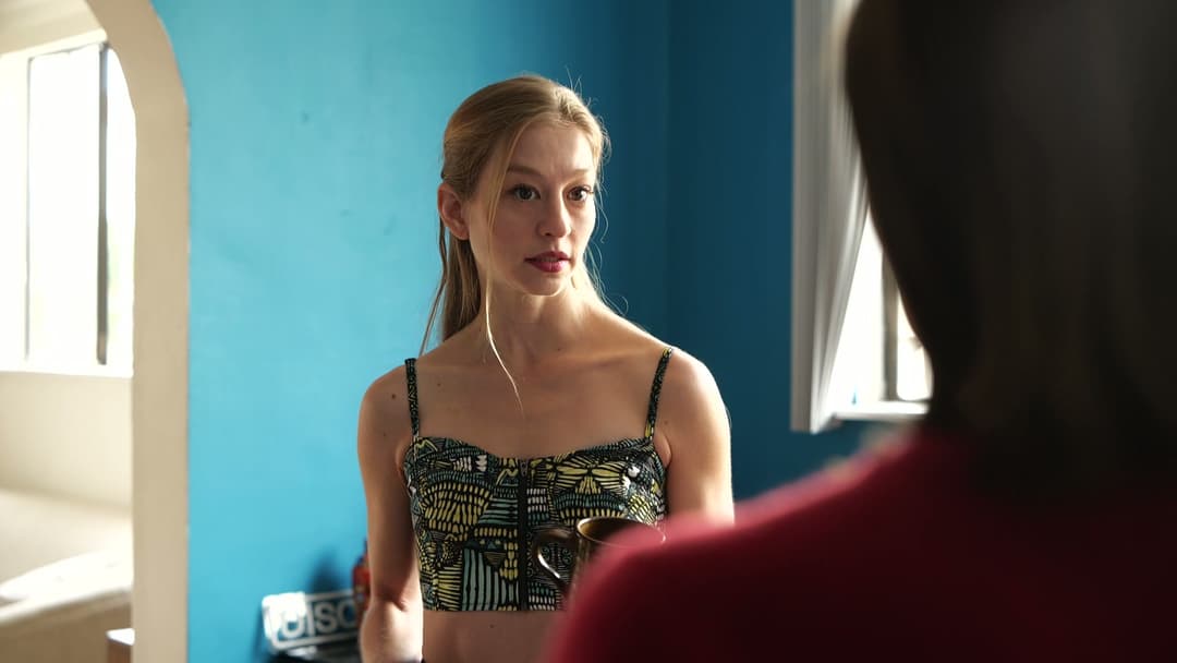 A woman standing and talking with her friend